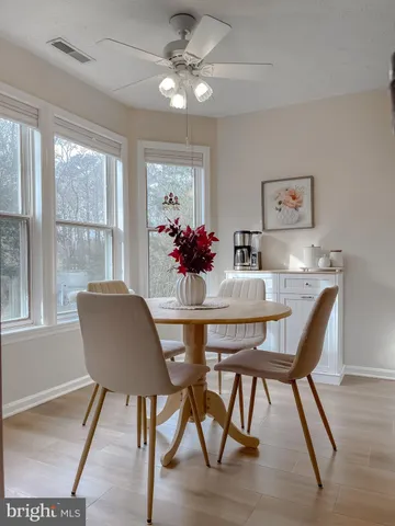 a kitchen with granite countertop a sink cabinets and stainless steel appliances