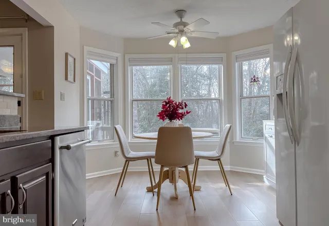 a kitchen with granite countertop wooden cabinets and stainless steel appliances