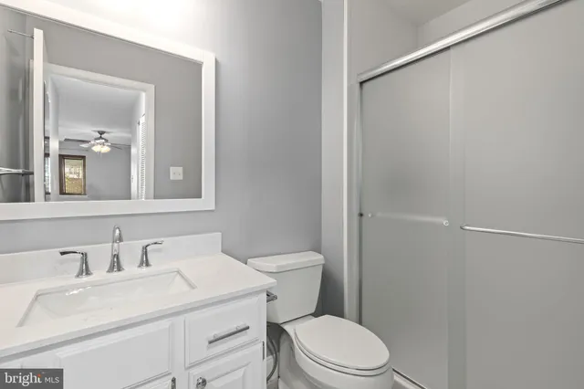 a bathroom with a sink toilet and vanity