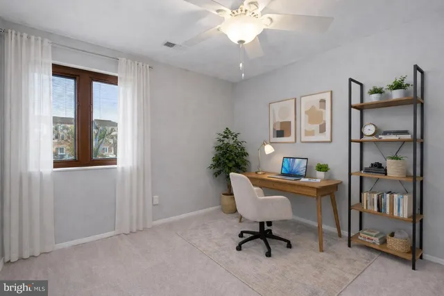 a workspace with furniture and window