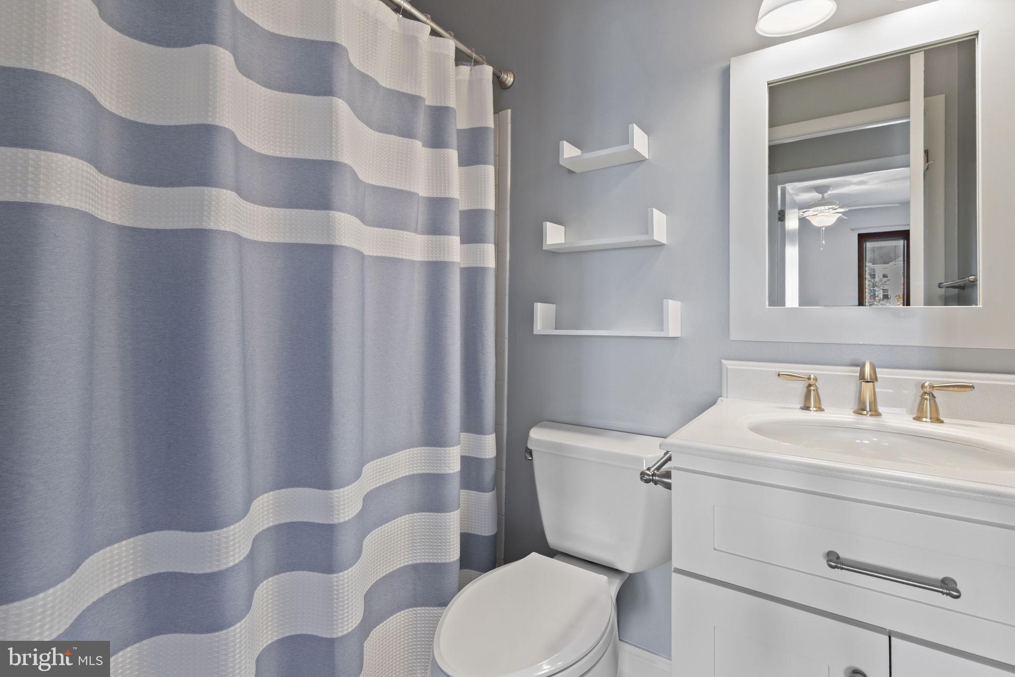 546 Riviera Drive, Unit 546B Joppa, MD 21085 - Photo 19 of 30 a bathroom with a sink toilet and shower