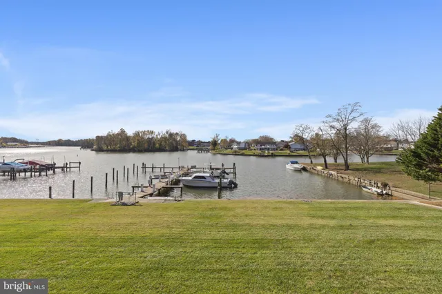 a view of a lake with houses in the back