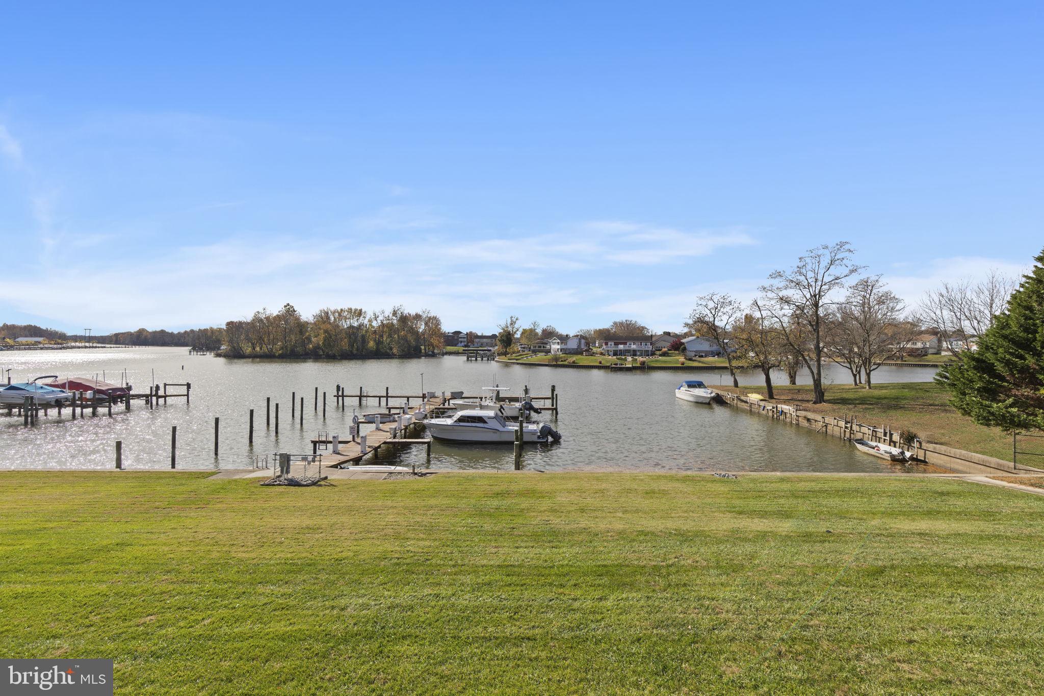 546 Riviera Drive, Unit 546B Joppa, MD 21085 - Photo 21 of 30 a view of a lake with houses in the back