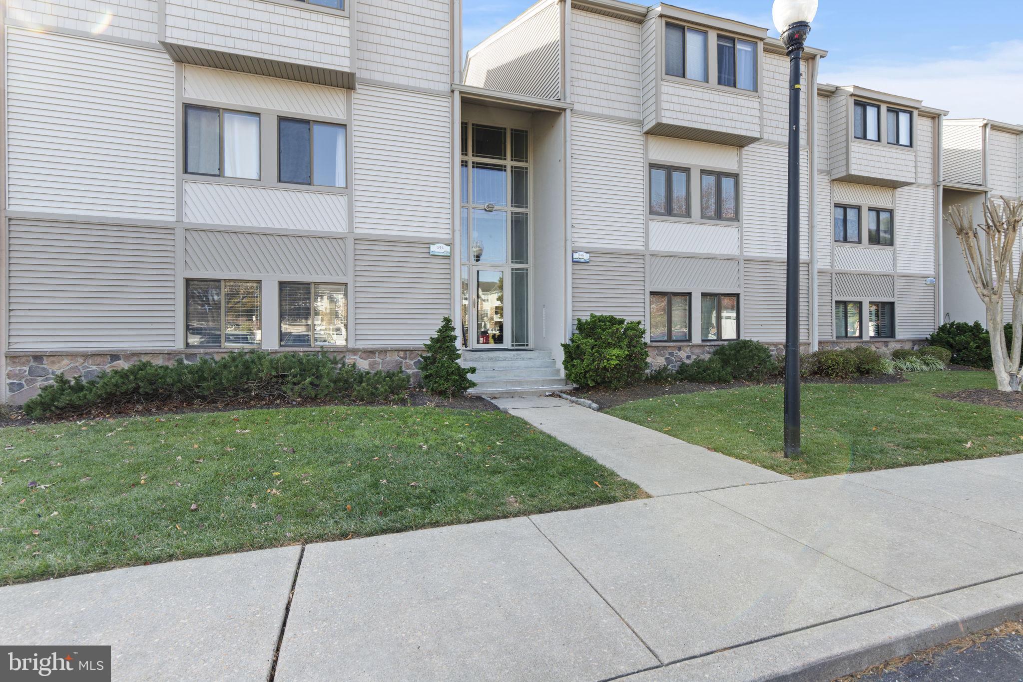 546 Riviera Drive, Unit 546B Joppa, MD 21085 - Photo 29 of 30 a view of a house with a yard