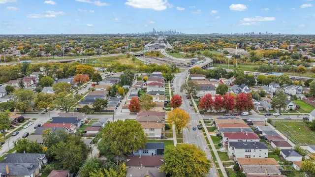 an aerial view of residential houses with outdoor space and river