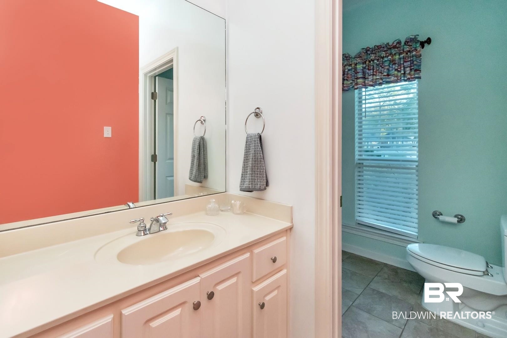 1050 Southern Way Court Mobile, AL 36609 - Photo 24 of 36 Bathroom featuring vanity, toilet, and tile patterned flooring