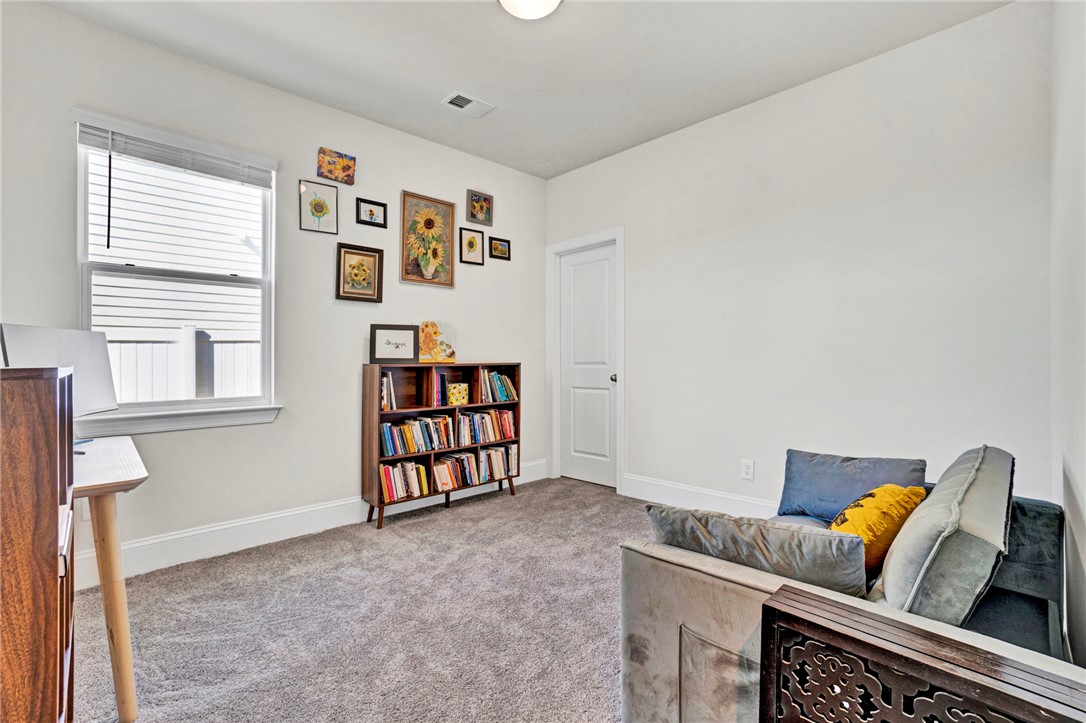 142 Juniper Hill Drive Easley, SC 29642 - Photo 35 of 47 This versatile room features plush carpeting and abundant natural light, offering a comfortable and adaptable space.