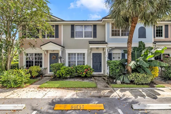a front view of a house with yard