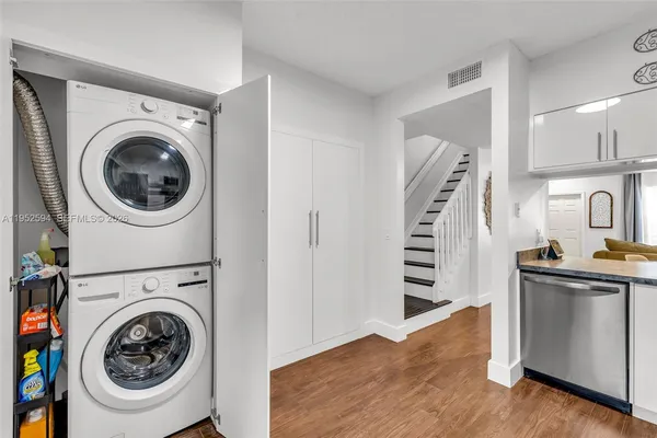 a view of a kitchen with washer and dryer