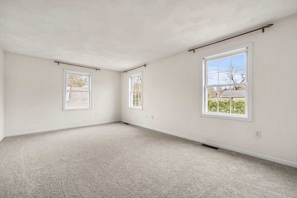 12 Horton Lane Billerica, MA 01821 - Photo 13 of 21 a view of an empty room with windows