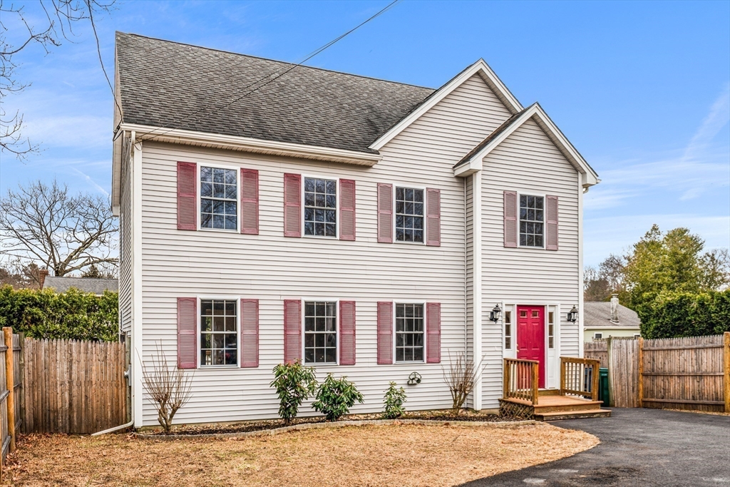 12 Horton Lane Billerica, MA 01821 - Photo 20 of 21 a front view of a house with a yard