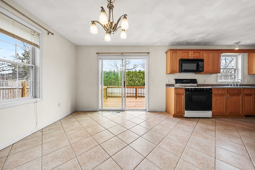 12 Horton Lane Billerica, MA 01821 - Photo 6 of 21 a view of a kitchen with microwave and windows
