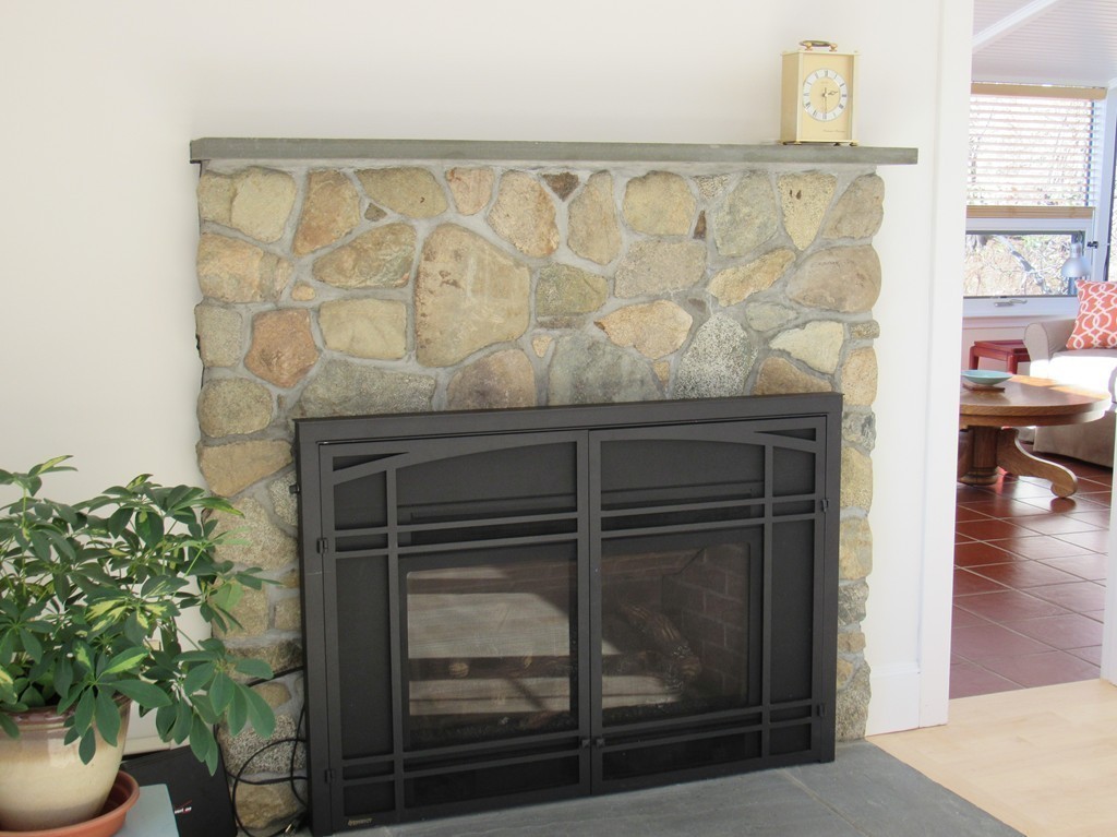 72 Little Neck Road Ipswich, MA 01938 - Photo 11 of 20 a living room with a fireplace and a potted plant