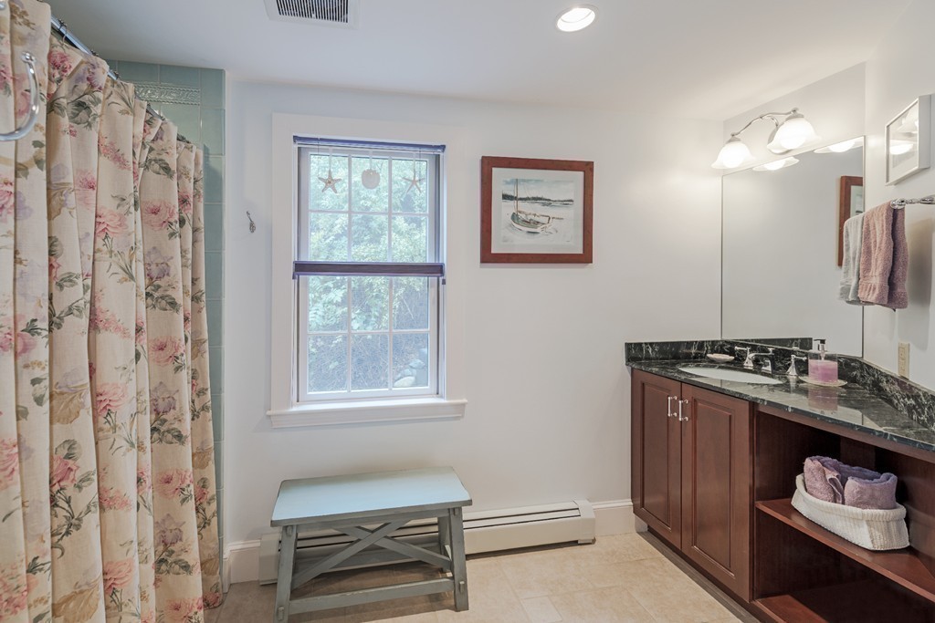 72 Little Neck Road Ipswich, MA 01938 - Photo 13 of 20 a bedroom with a bed and a window