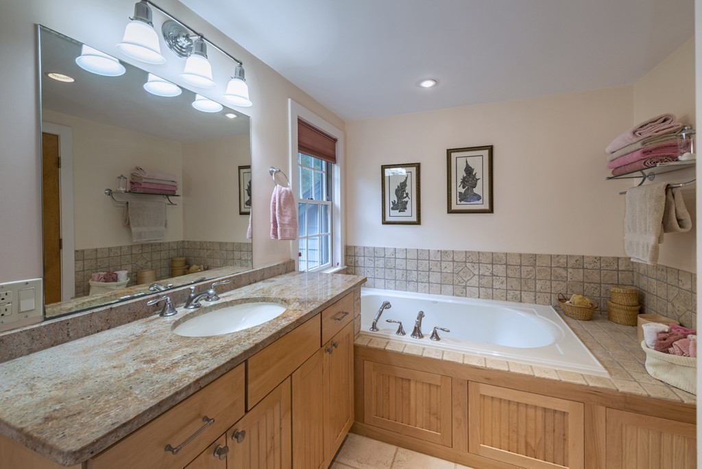 72 Little Neck Road Ipswich, MA 01938 - Photo 17 of 20 a bathroom with a granite countertop sink mirror and bathtub