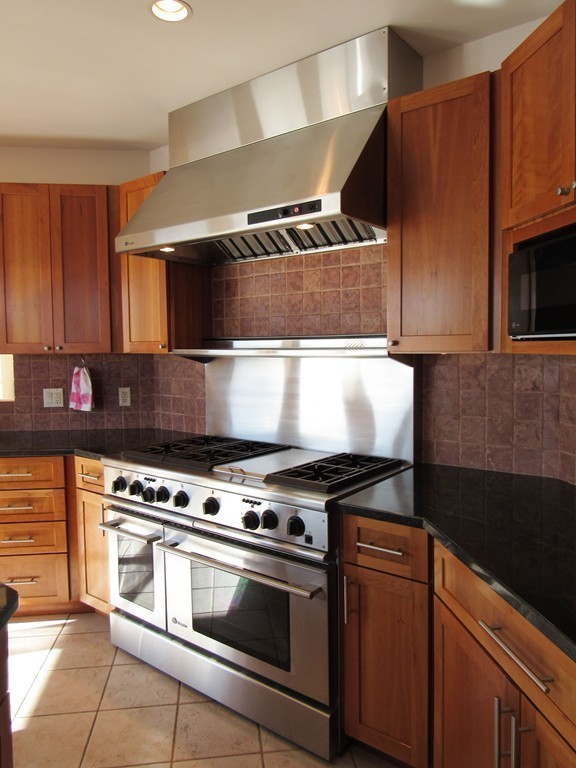 72 Little Neck Road Ipswich, MA 01938 - Photo 7 of 20 a stove top oven sitting inside of a kitchen