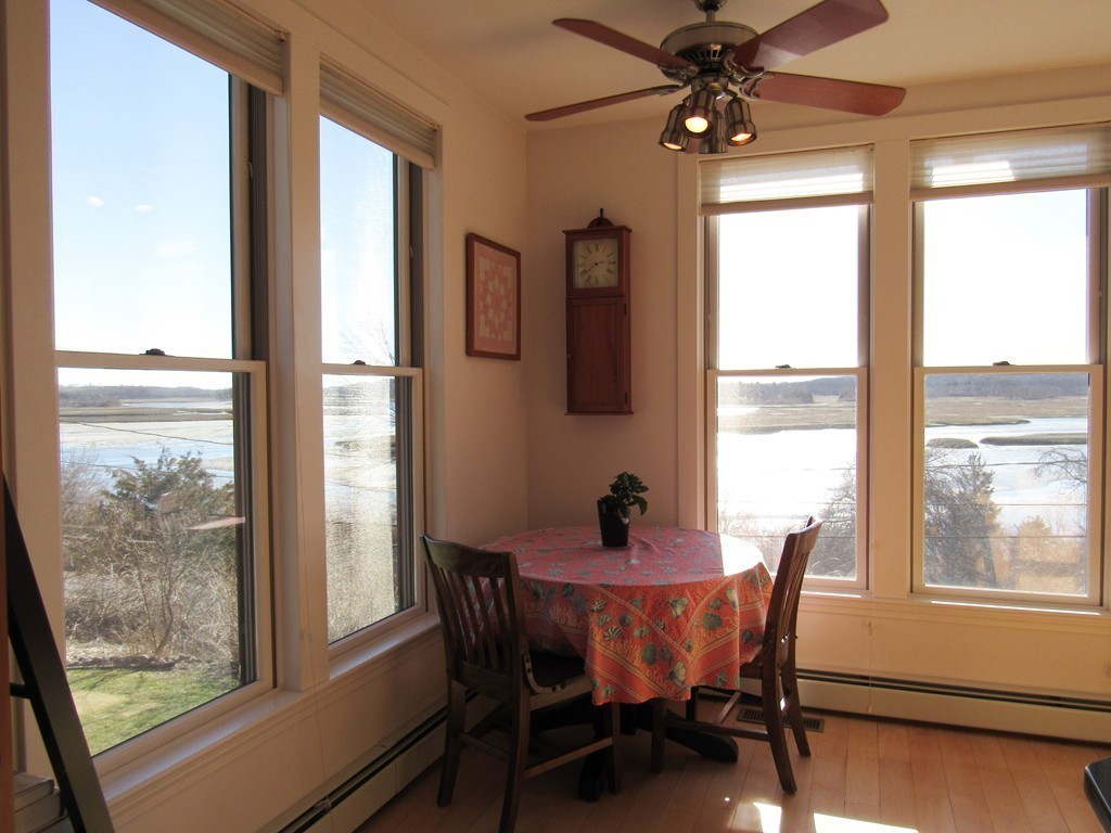 72 Little Neck Road Ipswich, MA 01938 - Photo 8 of 20 a view of a dining room with furniture window and outside view