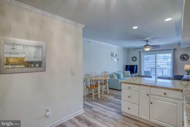 a living room with furniture chandelier and a fireplace