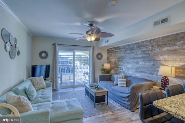 a view of kitchen and dining area with furniture wooden floor