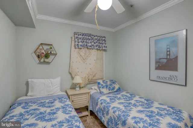 a bedroom with a bed mirror and a window