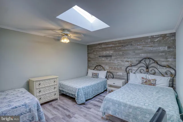 a bathroom with a toilet a sink and a mirror