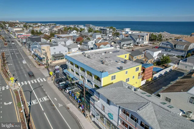 an aerial view of a house with a ocean view