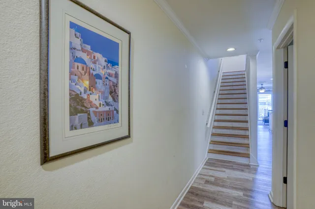 a kitchen with stainless steel appliances granite countertop a sink refrigerator and cabinets