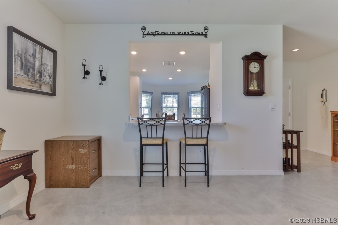302 Sunset View Drive Edgewater, FL 32141 - Photo 12 of 45 a view of a livingroom with furniture and windows