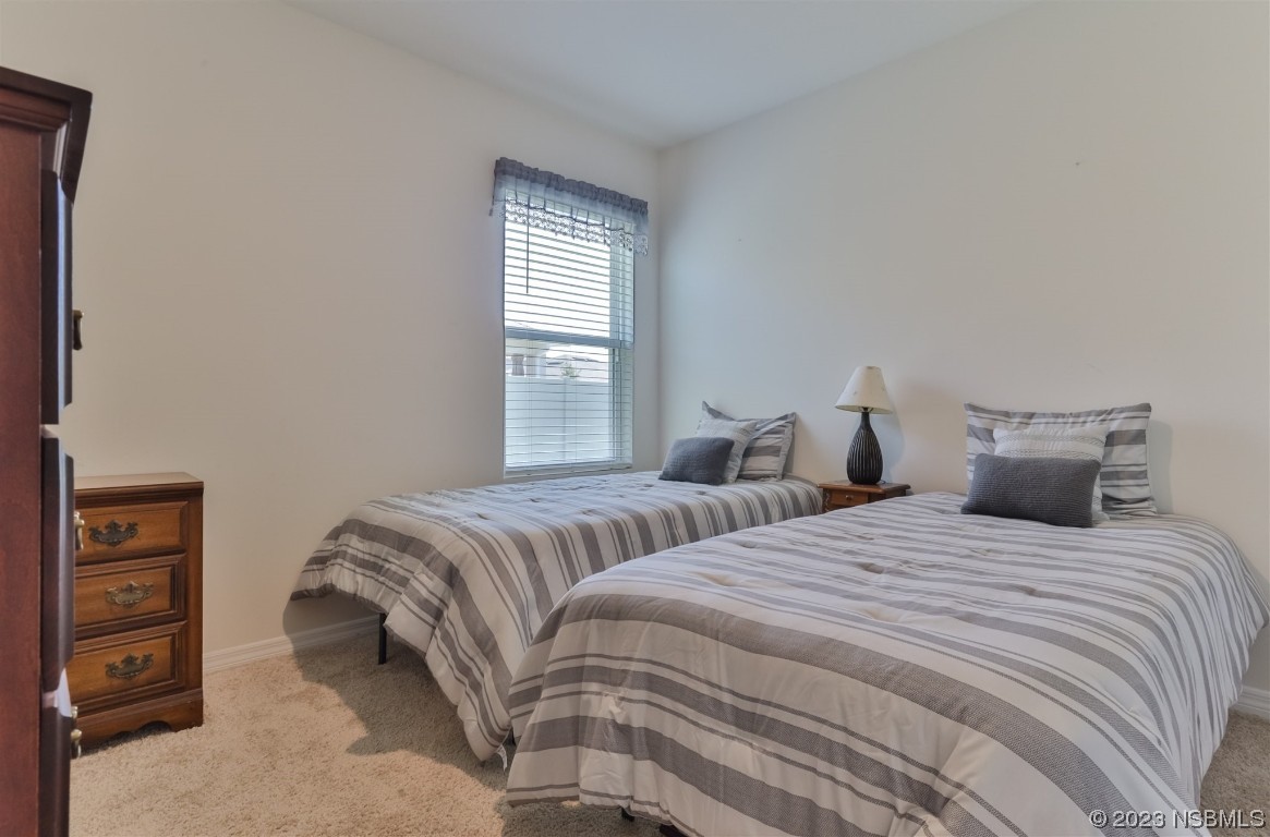 302 Sunset View Drive Edgewater, FL 32141 - Photo 25 of 45 a bedroom with two beds and a closet