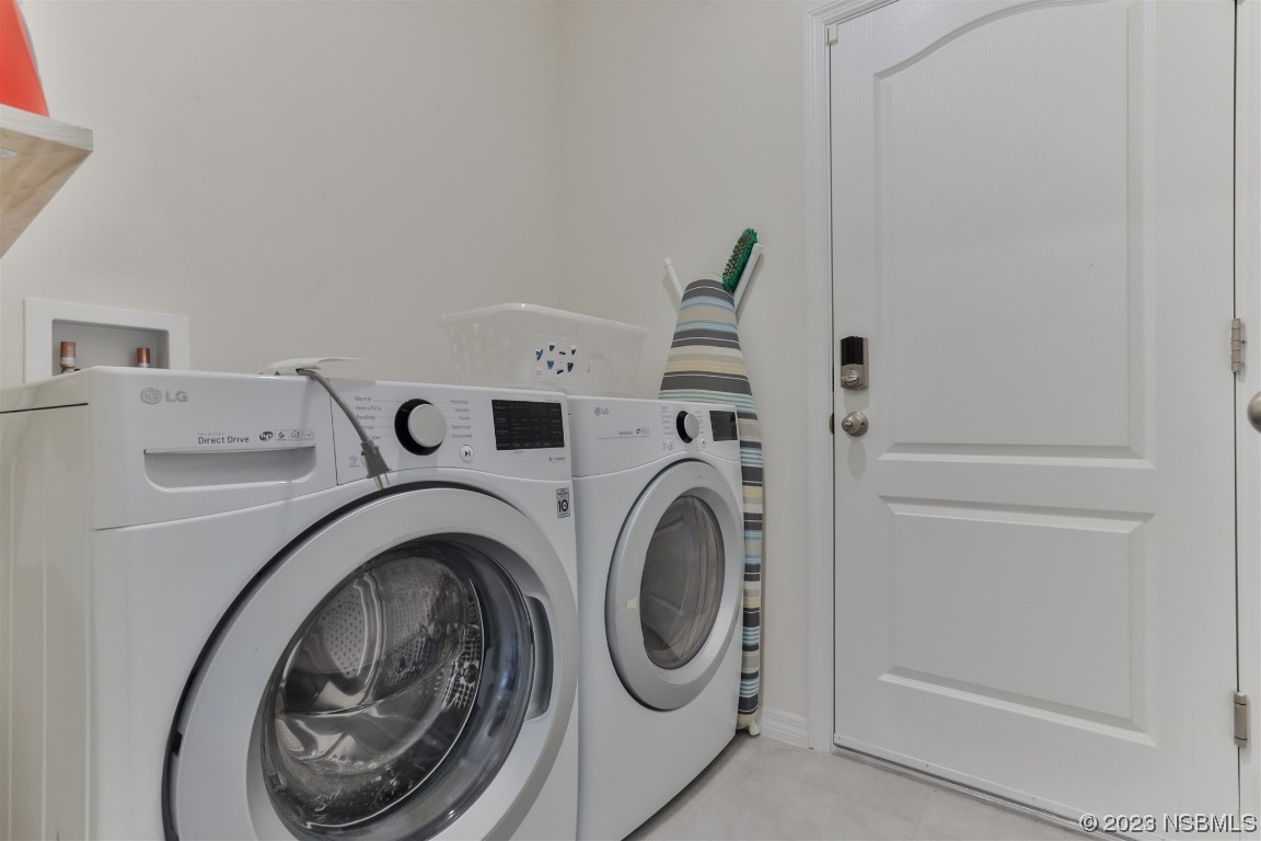 302 Sunset View Drive Edgewater, FL 32141 - Photo 29 of 45 a utility room with dryer and washer