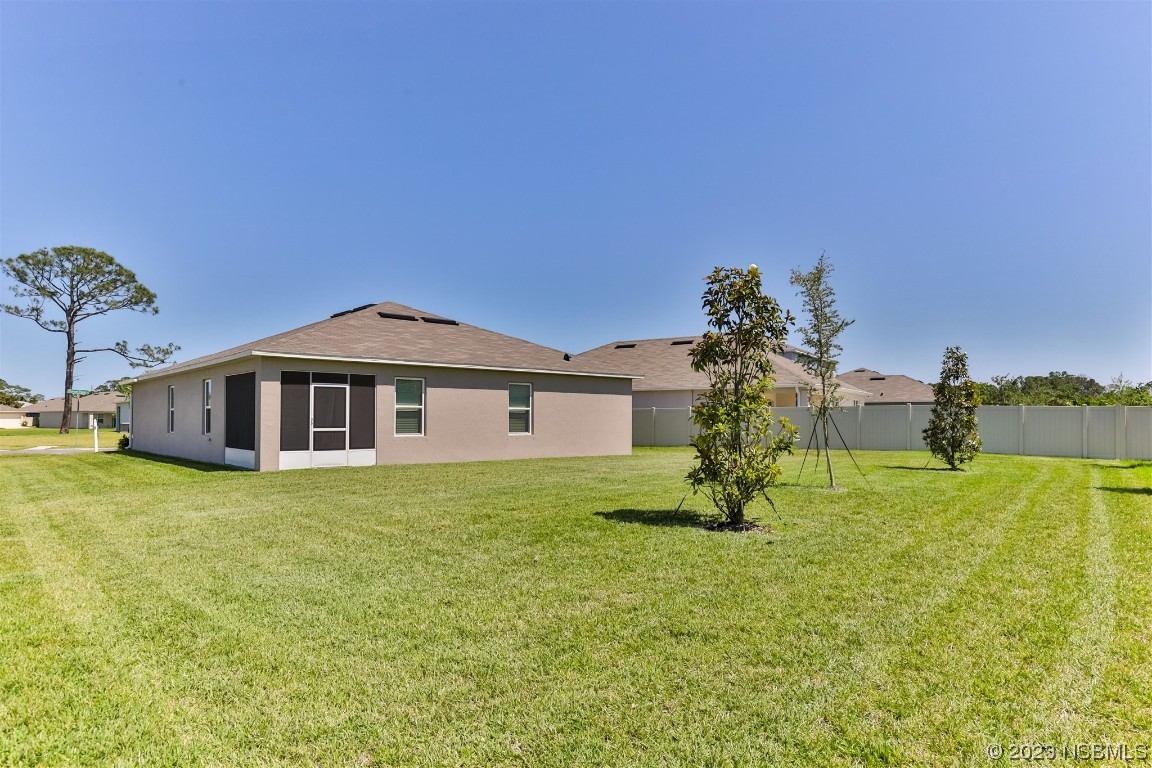 302 Sunset View Drive Edgewater, FL 32141 - Photo 33 of 45 a front view of a house with a yard
