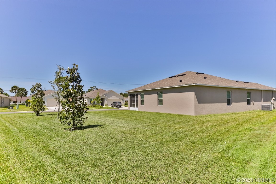 302 Sunset View Drive Edgewater, FL 32141 - Photo 34 of 45 a view of a house with a yard