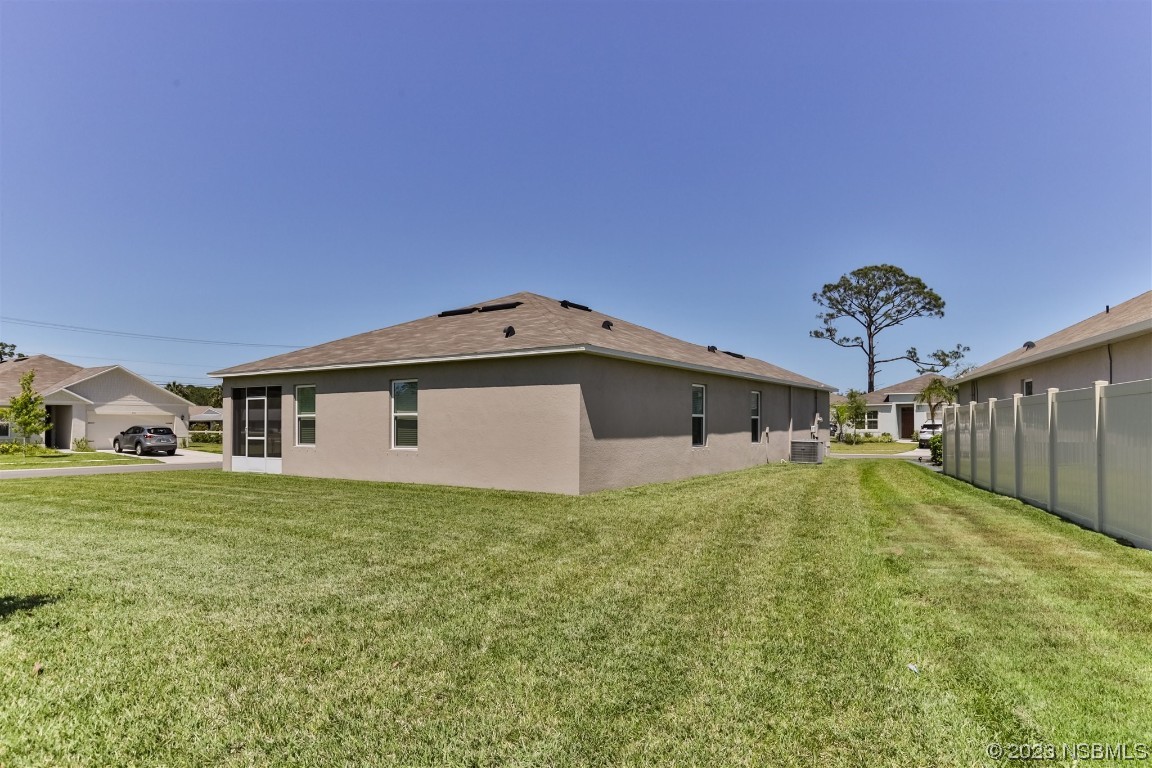 302 Sunset View Drive Edgewater, FL 32141 - Photo 35 of 45 a front view of a house with a yard