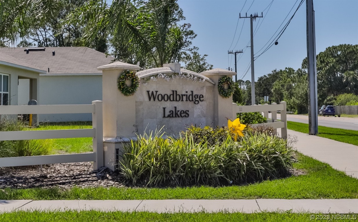 302 Sunset View Drive Edgewater, FL 32141 - Photo 36 of 45 a view of a house with a yard and potted plants