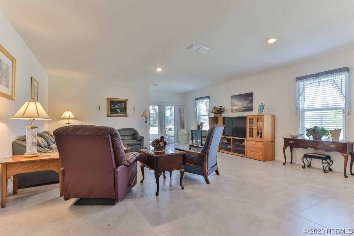 302 Sunset View Drive Edgewater, FL 32141 - Photo 9 of 45 a living room with furniture and a large window