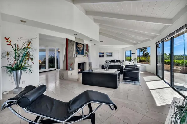 a living room with furniture and a table