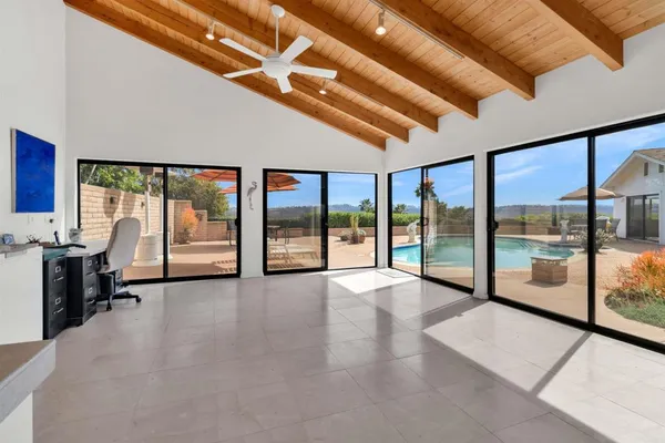 a view of an empty room with windows