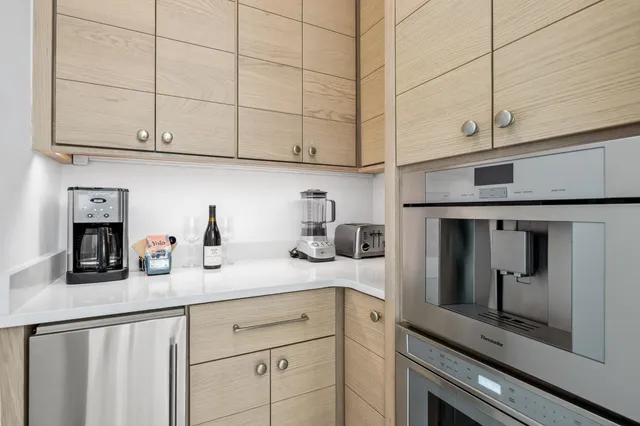 a bathroom with a sink a mirror and a window