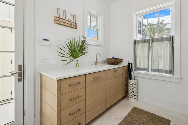 a bathroom with a sink mirror vanity and toilet