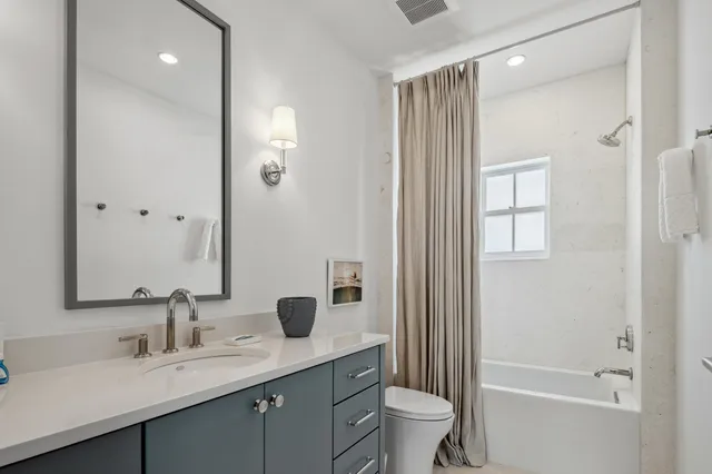 a bedroom with furniture and a flat screen tv