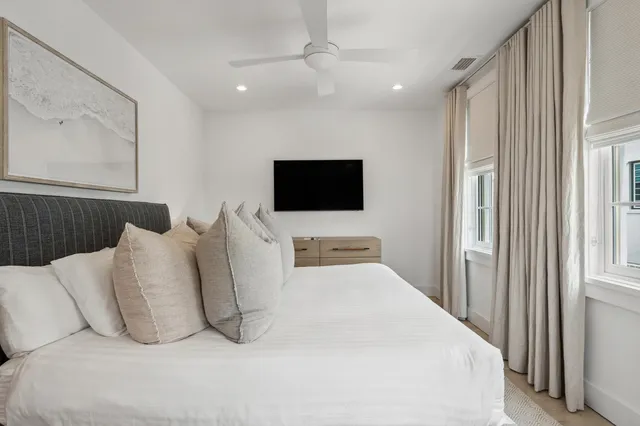 a bedroom with a bed and a couch