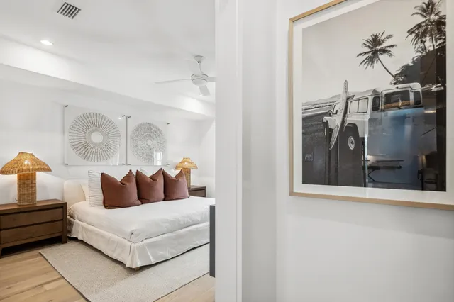 a bathroom with a toilet sink vanity shower and mirror