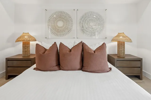 a bedroom with a bed and a mirror