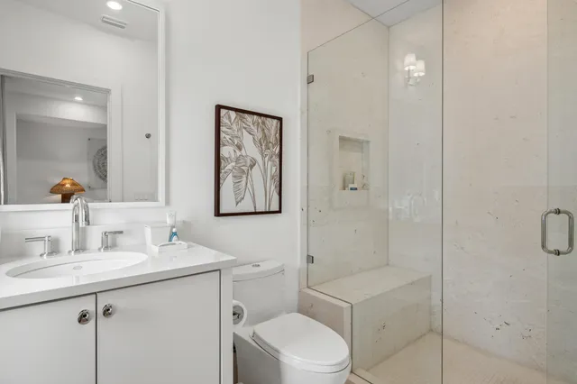 a bedroom with a bed and a flat tv screen