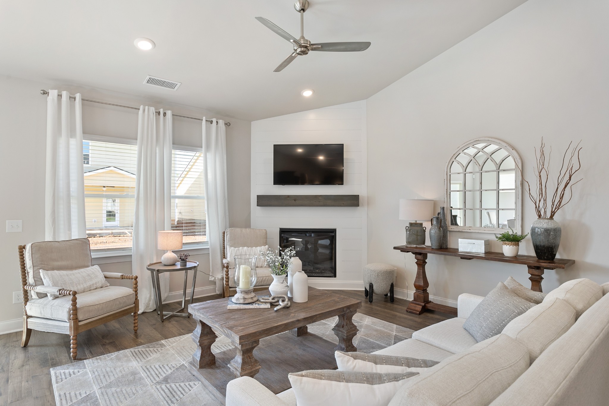 103 Riverview Run Madison, TN 37115 - Photo 23 of 54 a living room with furniture a fireplace and a flat screen tv