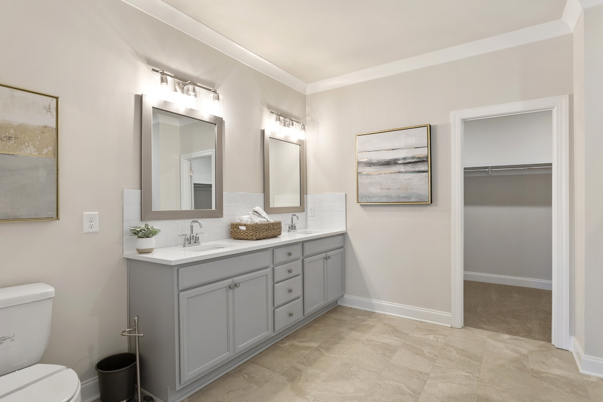 103 Riverview Run Madison, TN 37115 - Photo 41 of 54 a spacious bathroom with a toilet a double vanity sink and mirror