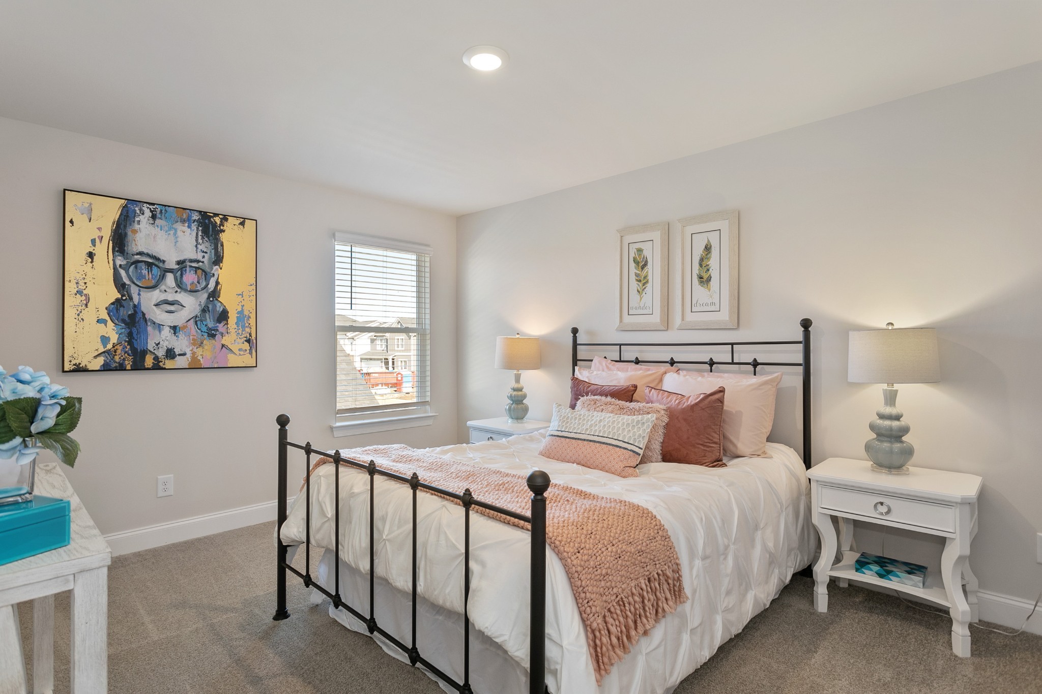 103 Riverview Run Madison, TN 37115 - Photo 42 of 54 a bedroom with a large bed and a chandelier