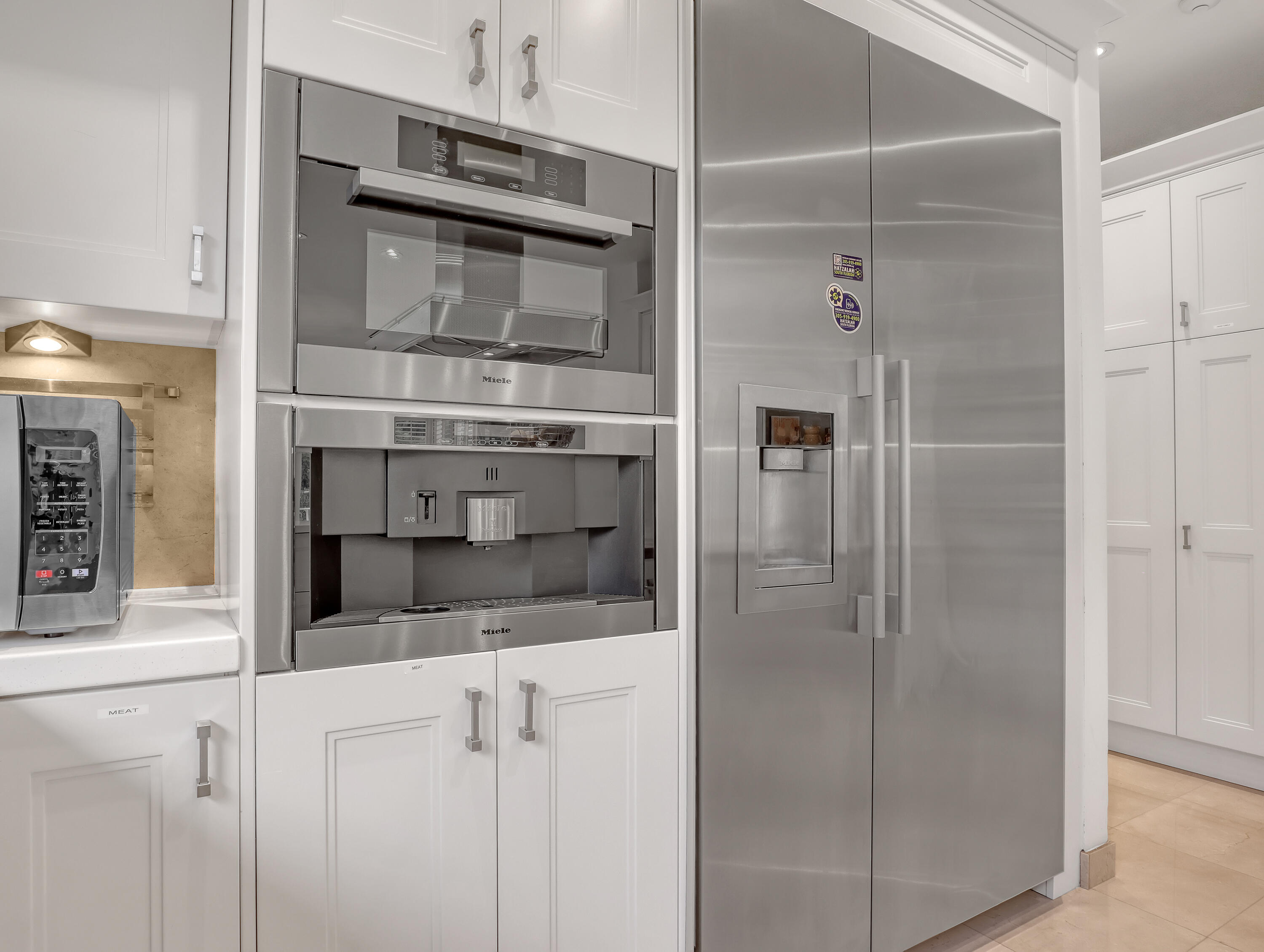 7207 Valencia Drive Boca Raton, FL 33433 - Photo 13 of 32 a kitchen with granite countertop a refrigerator and a sink