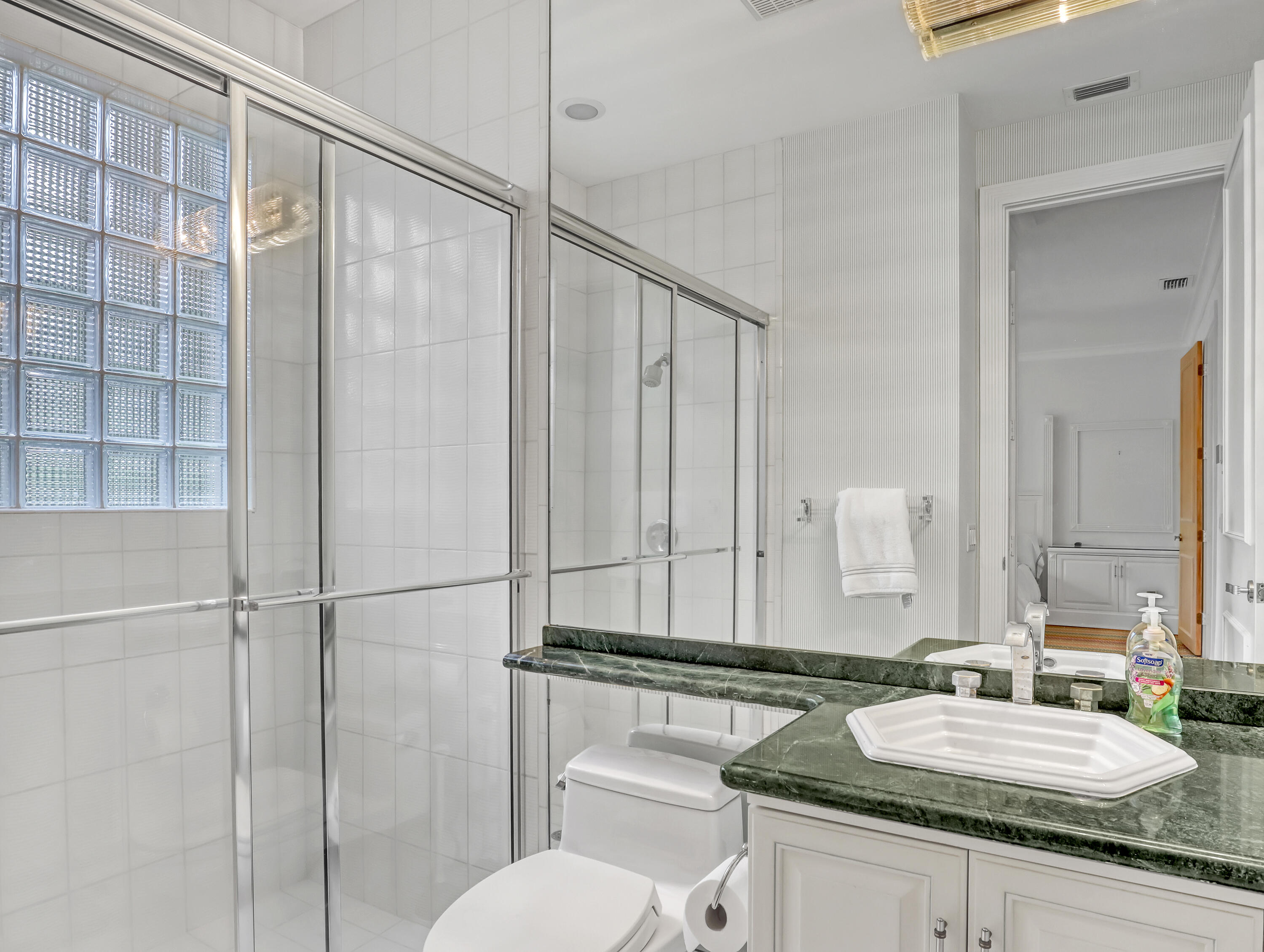7207 Valencia Drive Boca Raton, FL 33433 - Photo 23 of 32 a bathroom with a granite countertop sink and a mirror