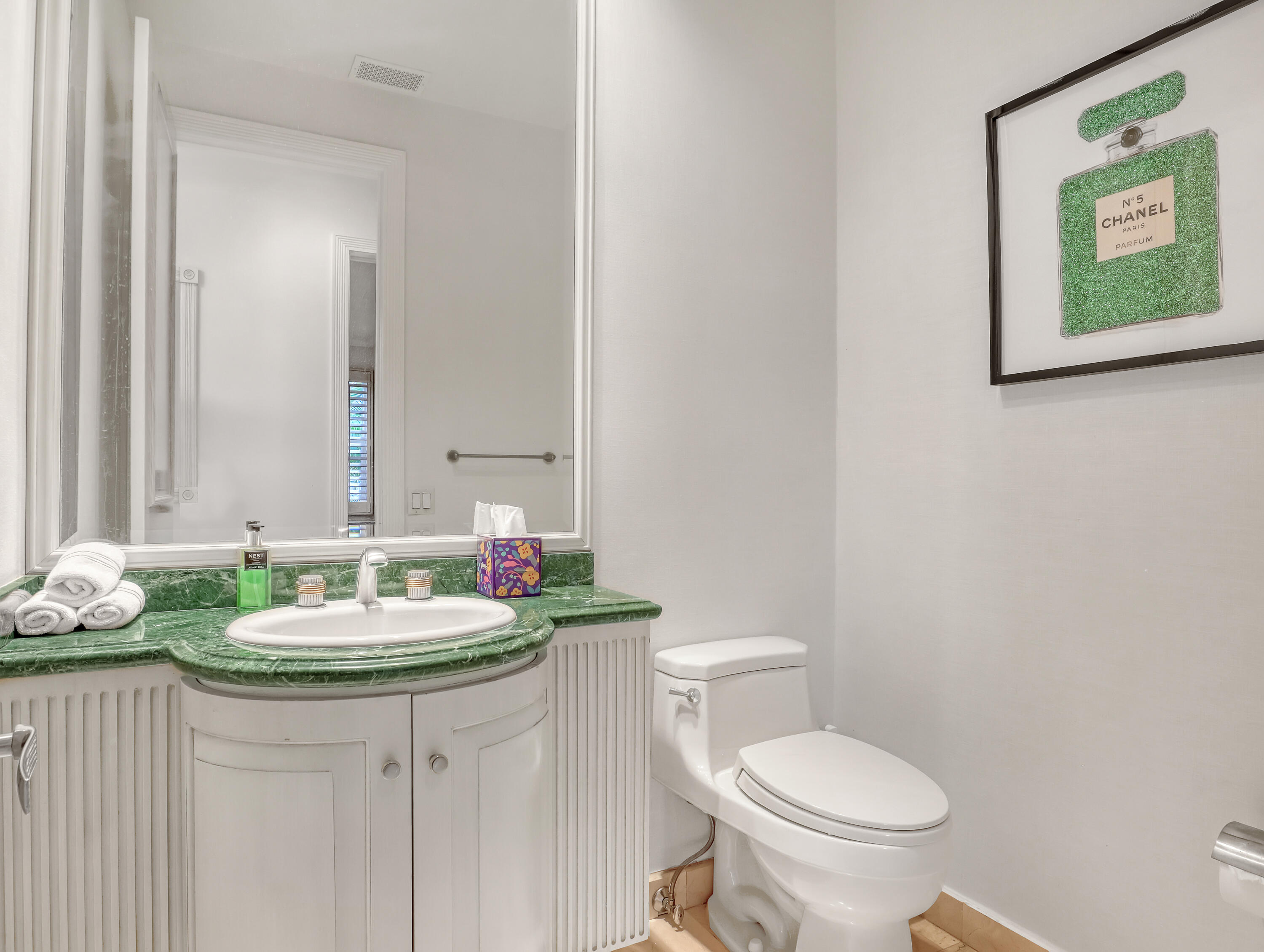 7207 Valencia Drive Boca Raton, FL 33433 - Photo 25 of 32 a bathroom with a toilet sink and mirror